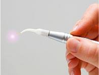 hand holding laser wand