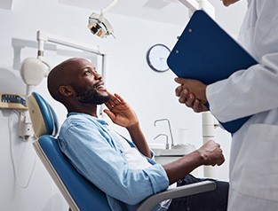 a dental patient talking to a dentist