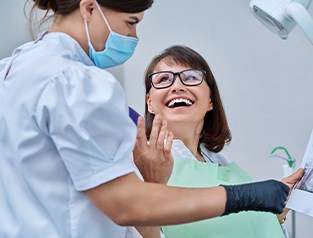 Woman smiling during routine dental checkup
