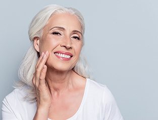 Woman with dentures smiling.