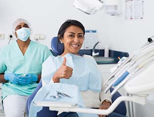 Woman smiling during routine dental checkup in Greenfield
