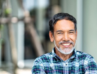 Man smiling with dental implants in Greenfield