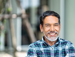 Senior bearded man with implant dentures in Greenfield, WI