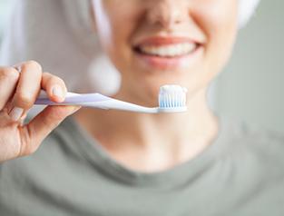 a person preparing to brush their teeth