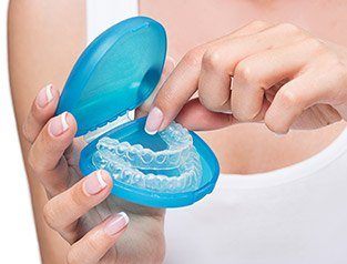 Closeup of Invisalign in a blue storage case