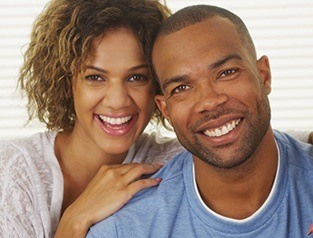 Smiling couple next to each other with straight teeth