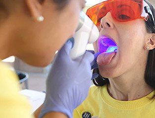 woman getting an oral cancer screening