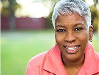 woman in pink smiling