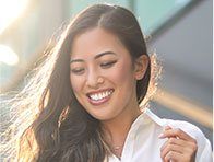 woman in sunlight smiling