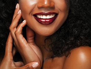 woman with red lipstick on smiling