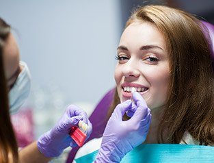 woman getting porcelain veneers