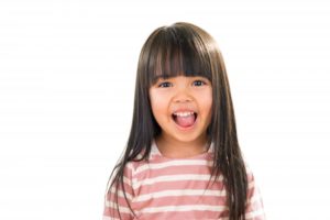 Young girl smiling.