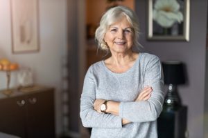 Woman smiling with dental implants