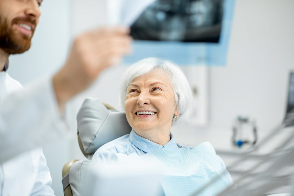 woman learning about parts of the mouth in Greenfield