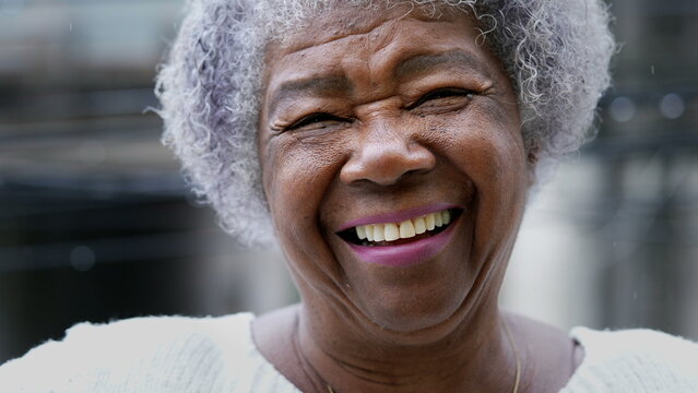 older person with dentures smiling