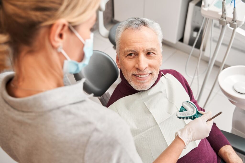 A man at a dental appointment to get dentures