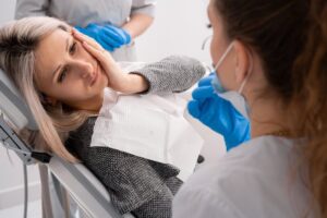 Woman with dental emergency.